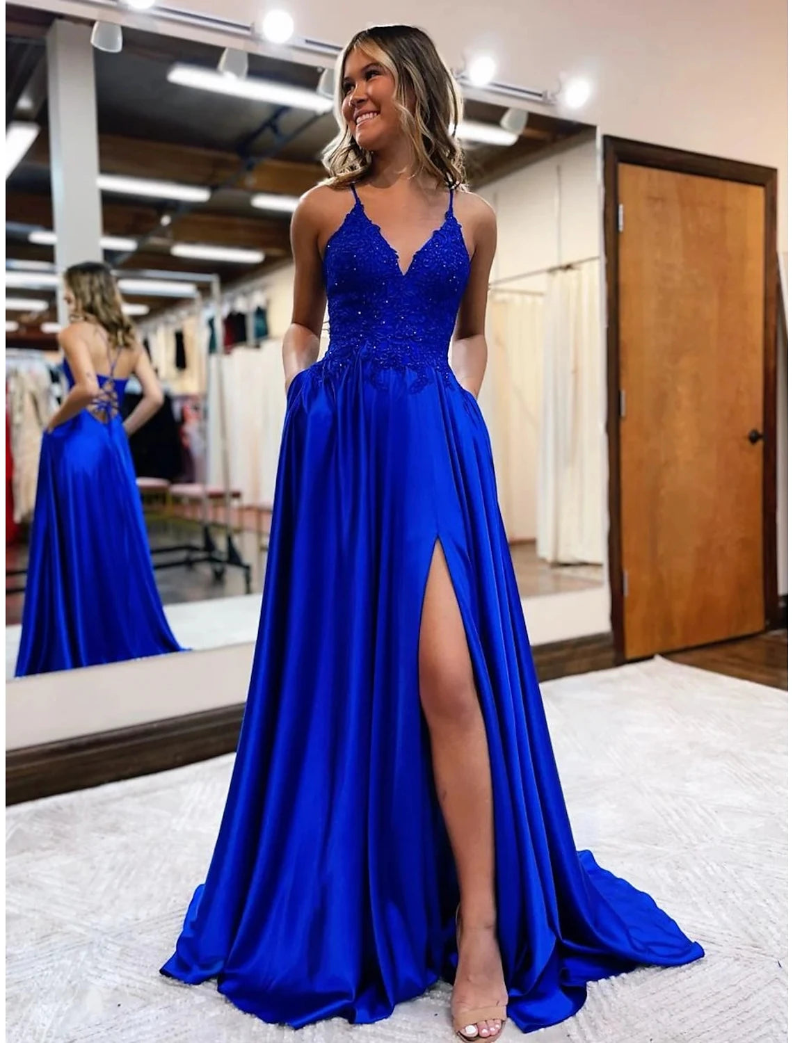 Elegant A-Line satin prom dress with V-neck and beading appliques.