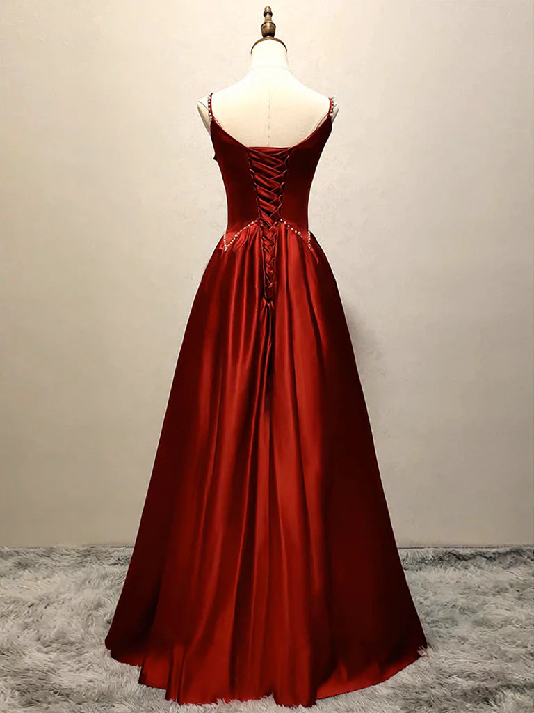 Woman in a flowing A-line satin evening gown, showcasing the luxurious fabric.