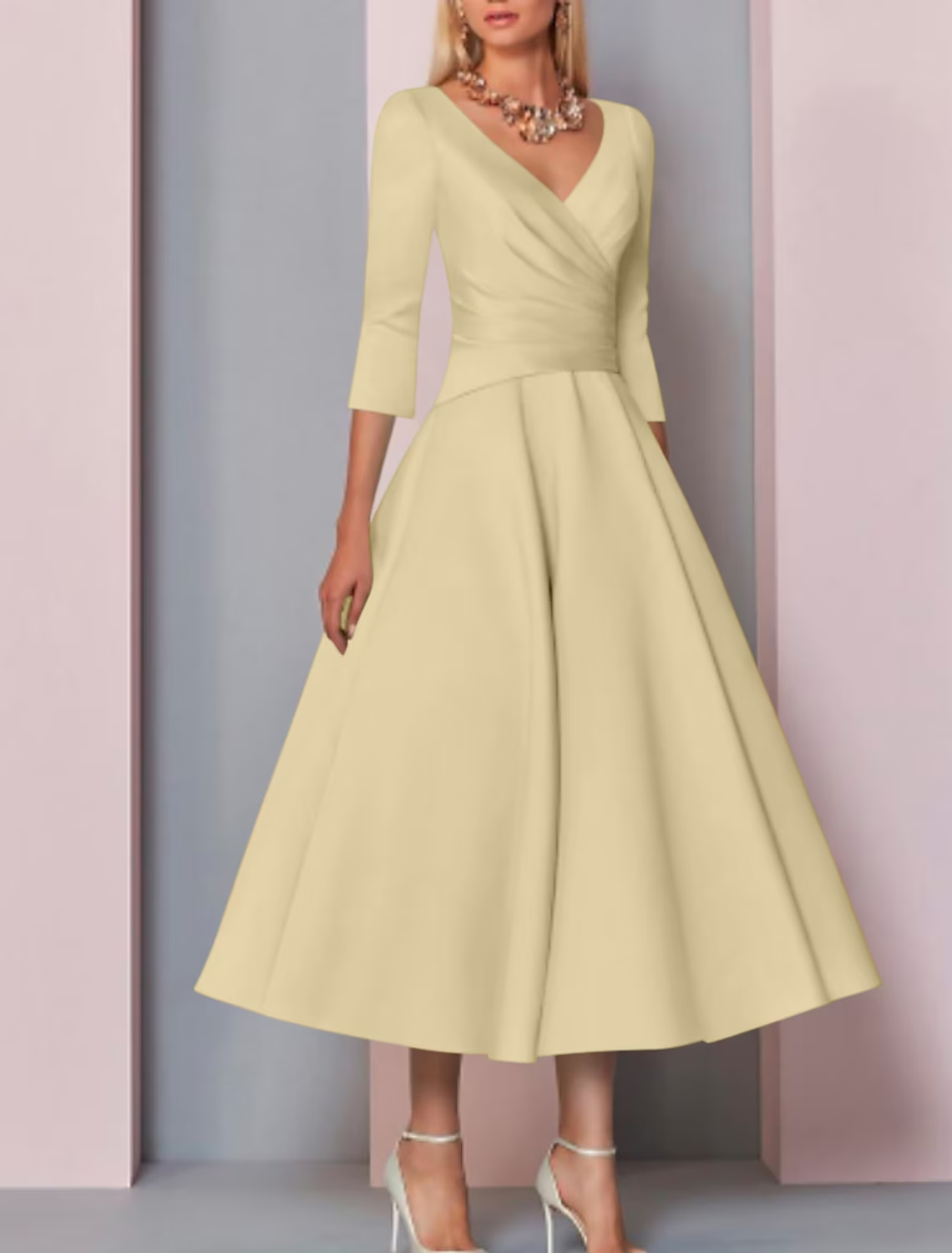 Close-up of the V-neckline and 3/4 sleeve on the elegant satin dress.