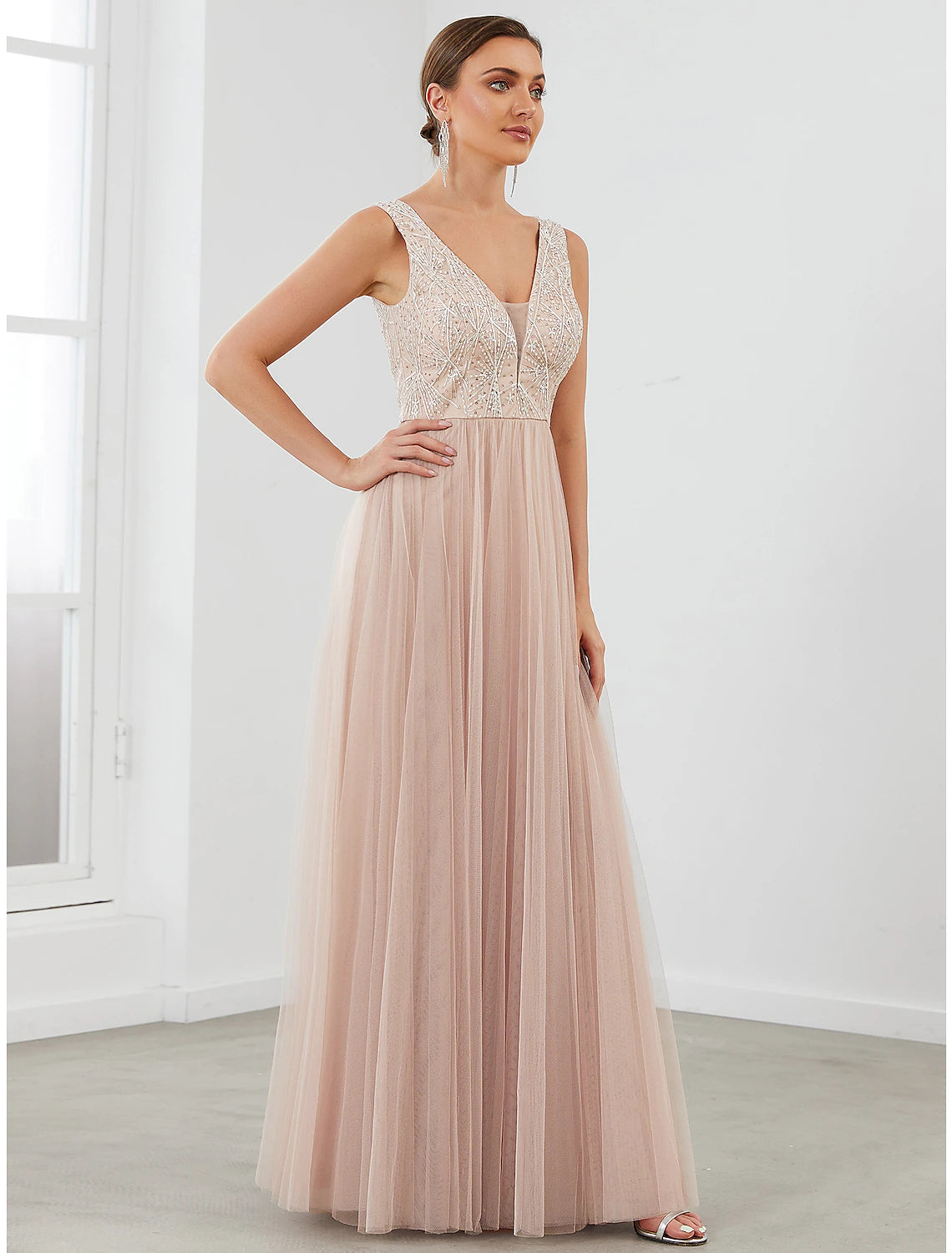 Back view of the A-Line gown, showcasing the V-back and sequin details.