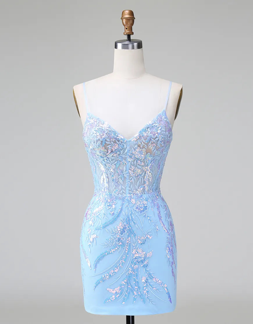 Close-up of sequined and embroidered detail on a formal dress.