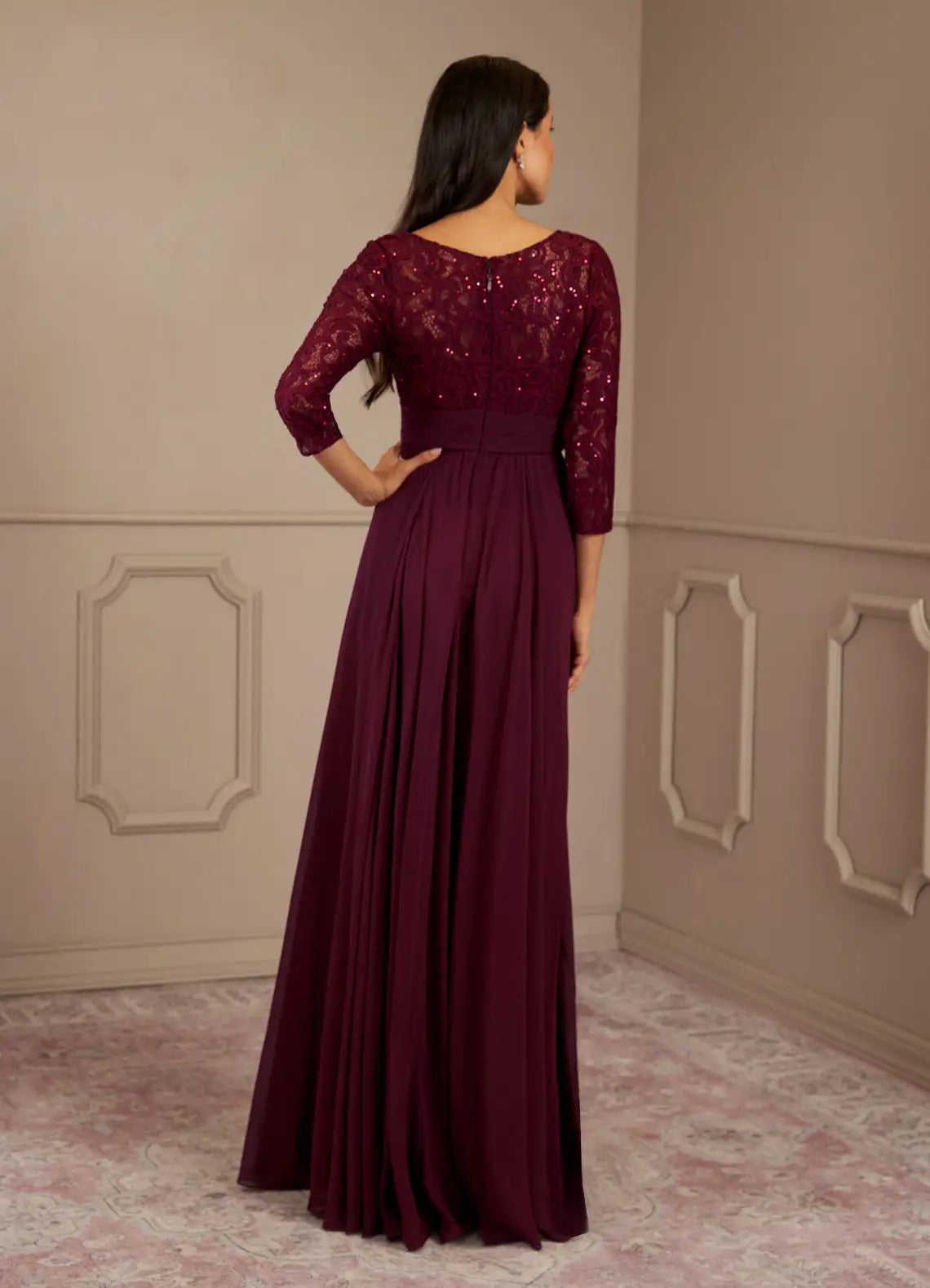 Full view of a woman in a sparkling Cabernet A-Line evening gown.