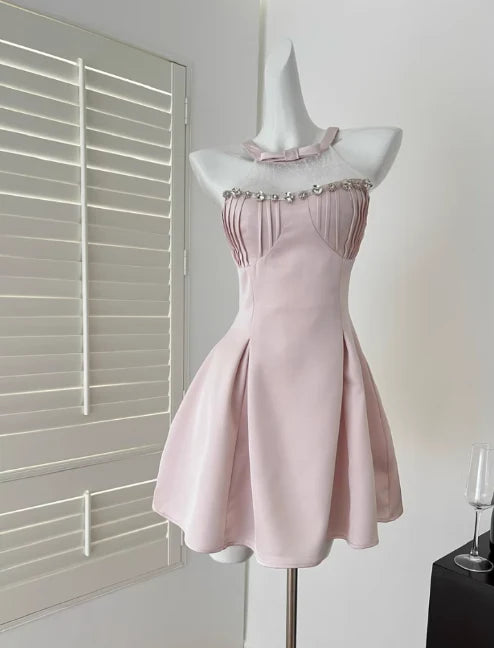 Elegant pink A-line V-neck short dress on a model.