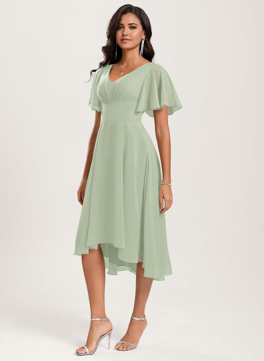 Woman wearing an elegant A-line V-neck short sleeve chiffon dress with an asymmetrical hem.