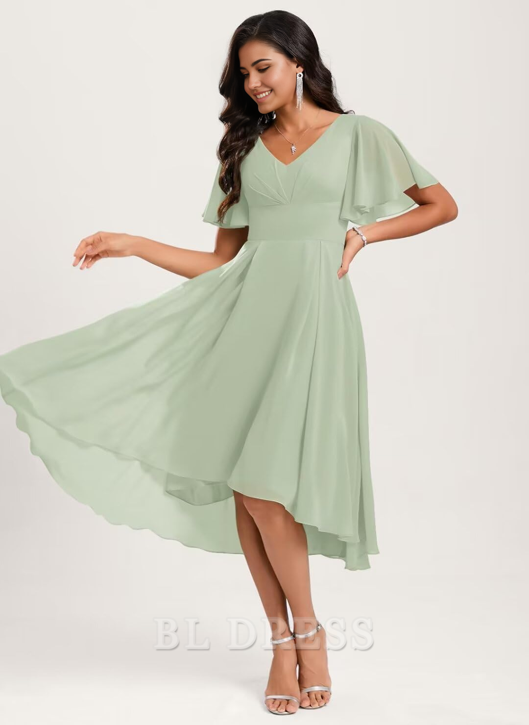 Side view of a woman in an A-line V-neck short sleeve chiffon dress, highlighting the asymmetrical design.