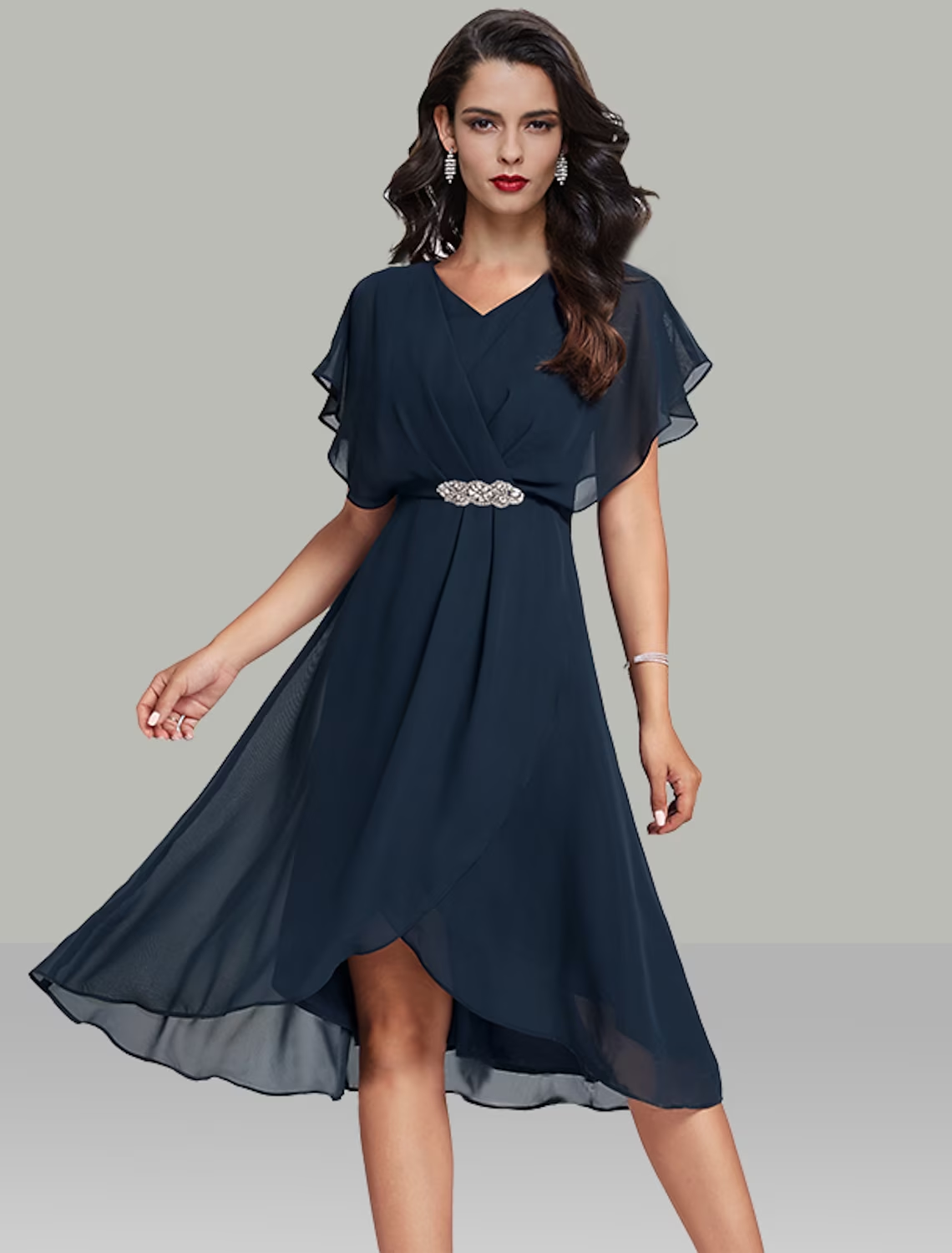 Elegant A-line V-neck tea length wedding guest dress with beading and sash.