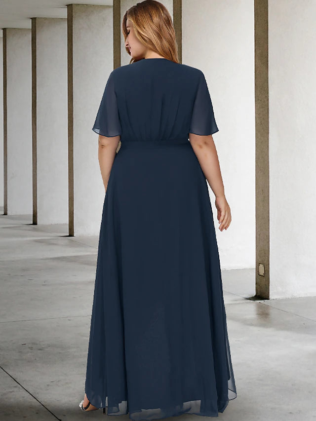 Back view of a plus size formal dress, highlighting the short sleeves and graceful drape.