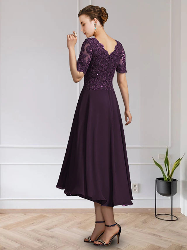 Elegant floor-length A-Line gown featuring V-neck, short sleeves, and delicate appliques.