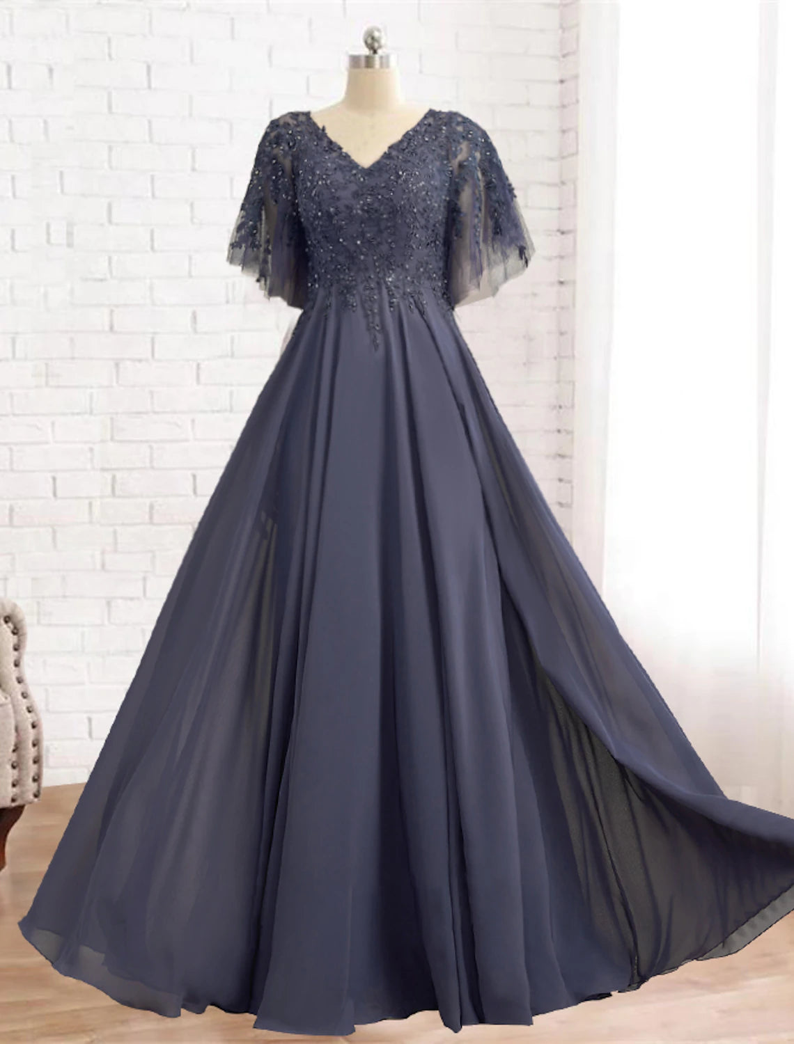 Elegant A-line V-neck Mother of the Bride dress with short sleeves, chiffon lace, pleats, beading, and appliques.