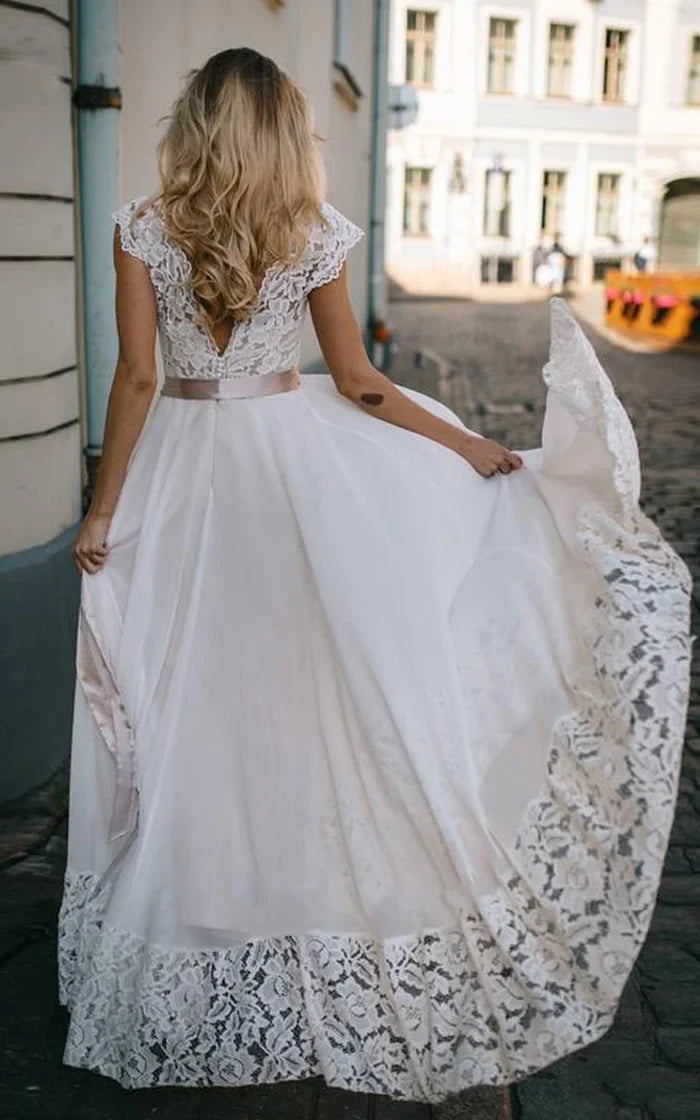 Back view of A-Line wedding dress, showing floor-length skirt and ribbon.