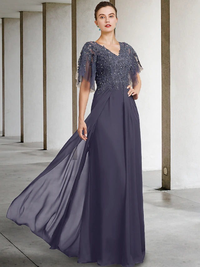 Close-up of beading and sequin appliques on chiffon lace dress.