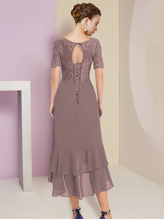 Close-up of delicate lace appliques on the chiffon dress.