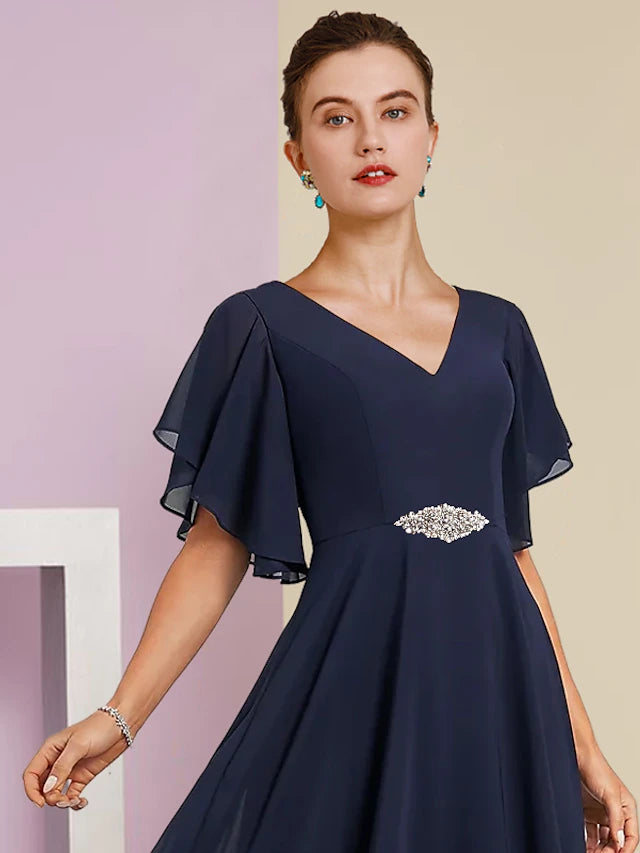 Side view of the A-line chiffon lace dress, highlighting the short sleeves and tea length.