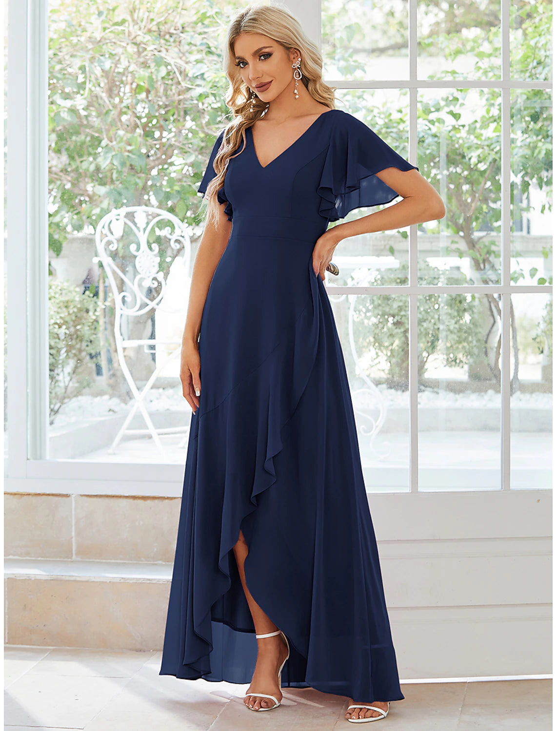 Full length view of A-line wedding guest dress in chiffon.