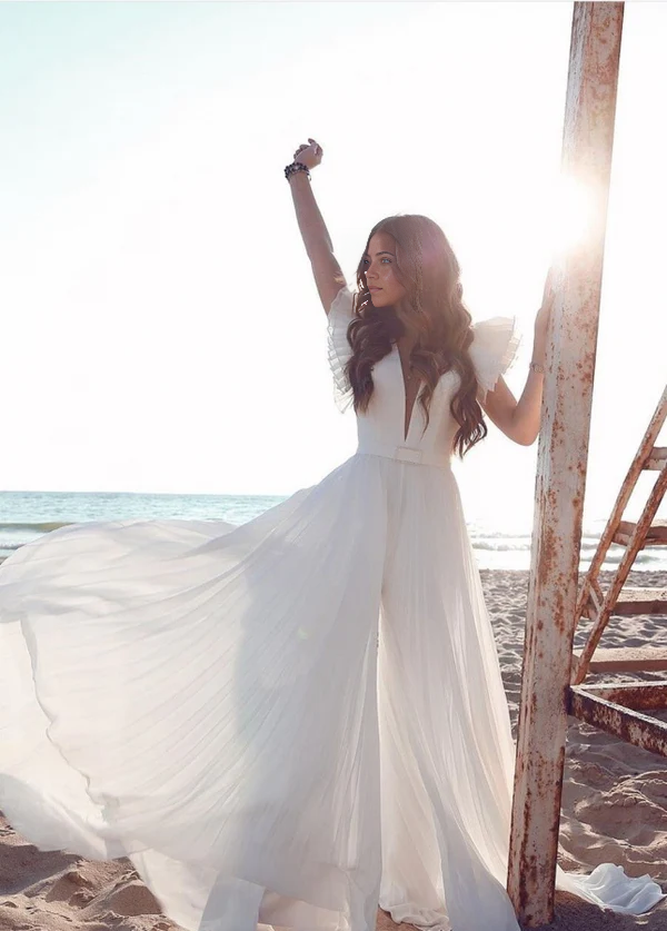 Model wearing an A-Line V-Neck chiffon wedding dress with short sleeves.