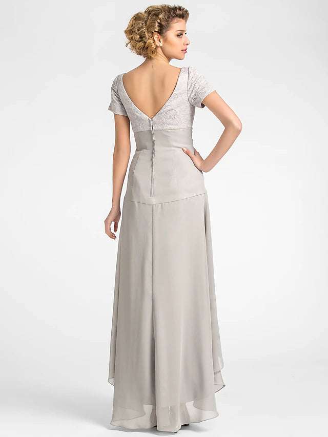 Side view of the A-line floral chiffon mother of the bride dress, showcasing the short sleeves and pleated details.