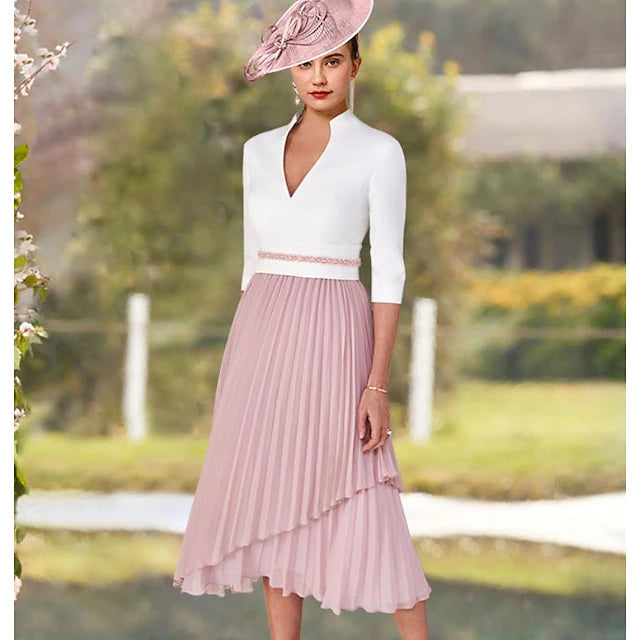 Back view of an A-Line Mother of the Bride dress, showing the short sleeves and tea-length hem.