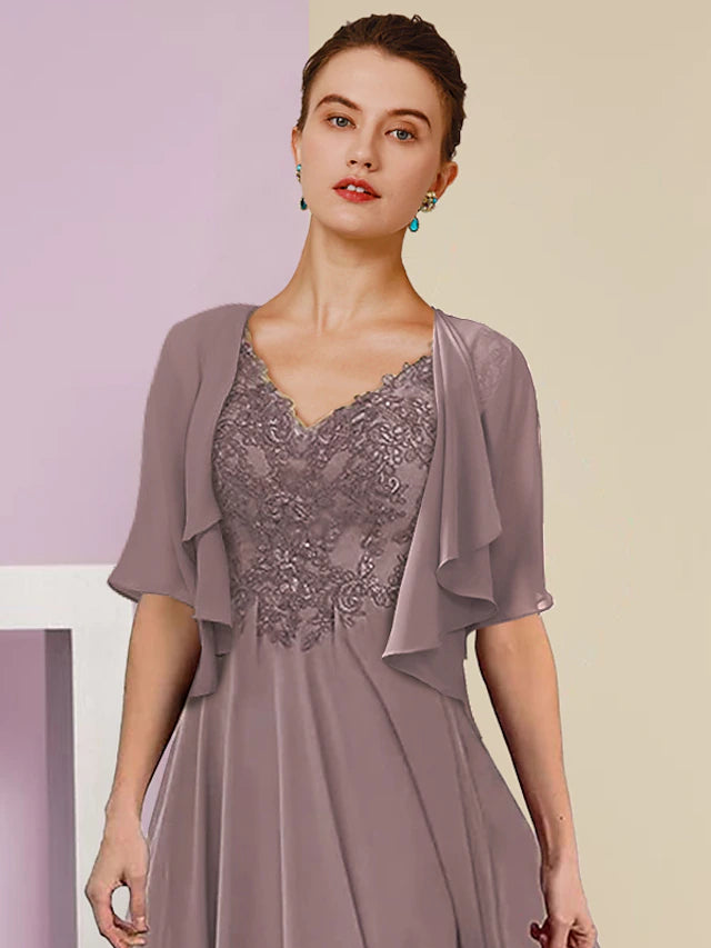 Back view of the tea length formal wedding guest dress with pleats.
