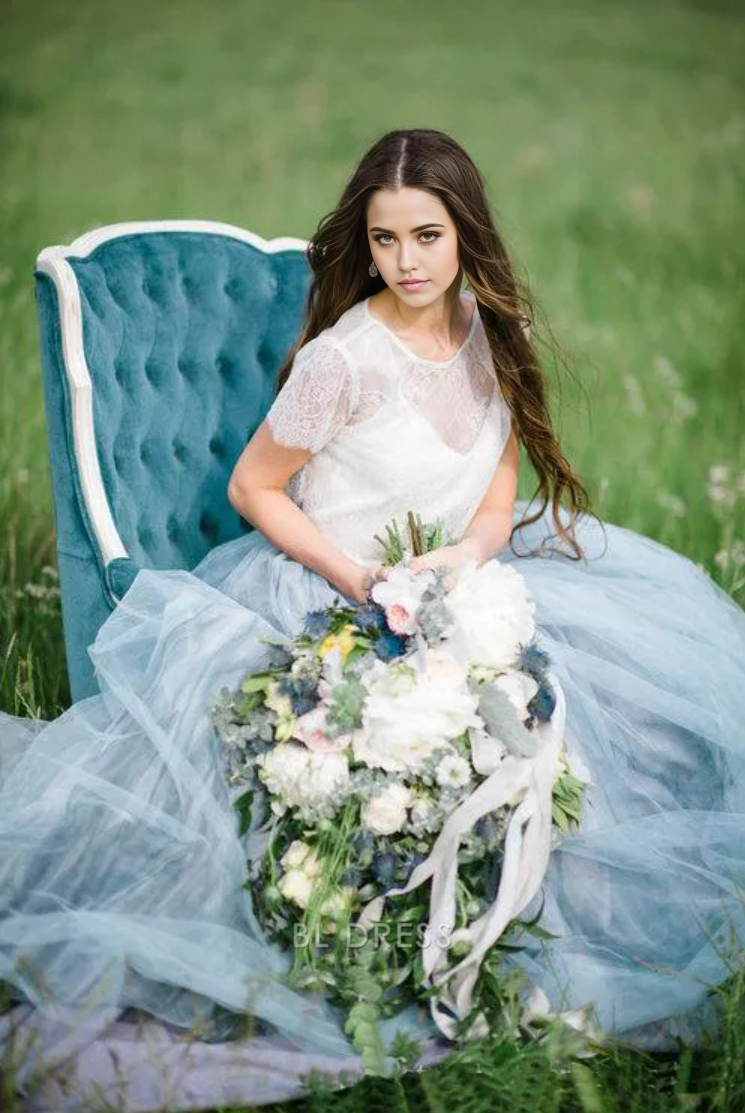 Side profile of A-line short sleeve wedding gown.