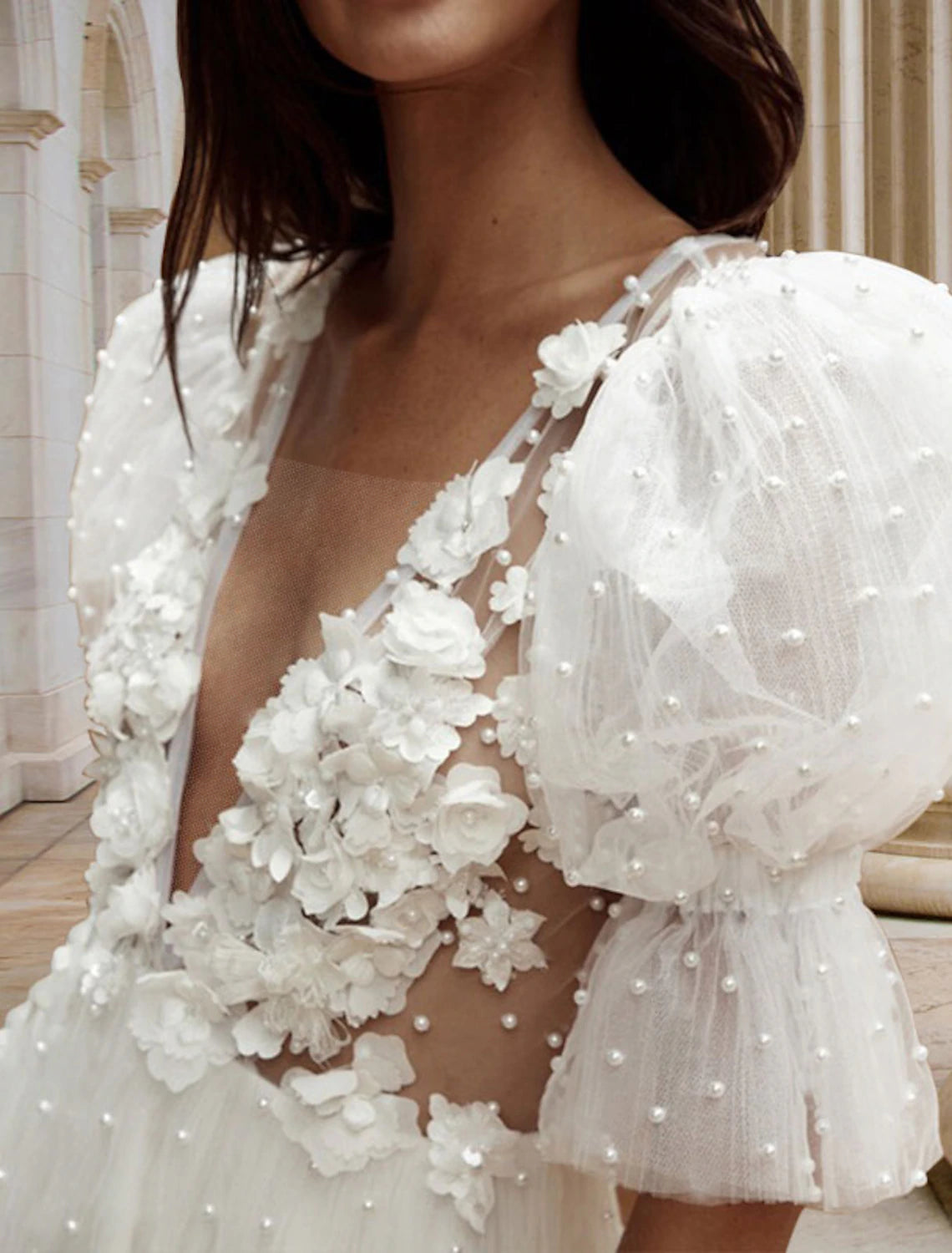 Back view of white A-Line V-Neck mini bridal dress showing open back and pearl details.
