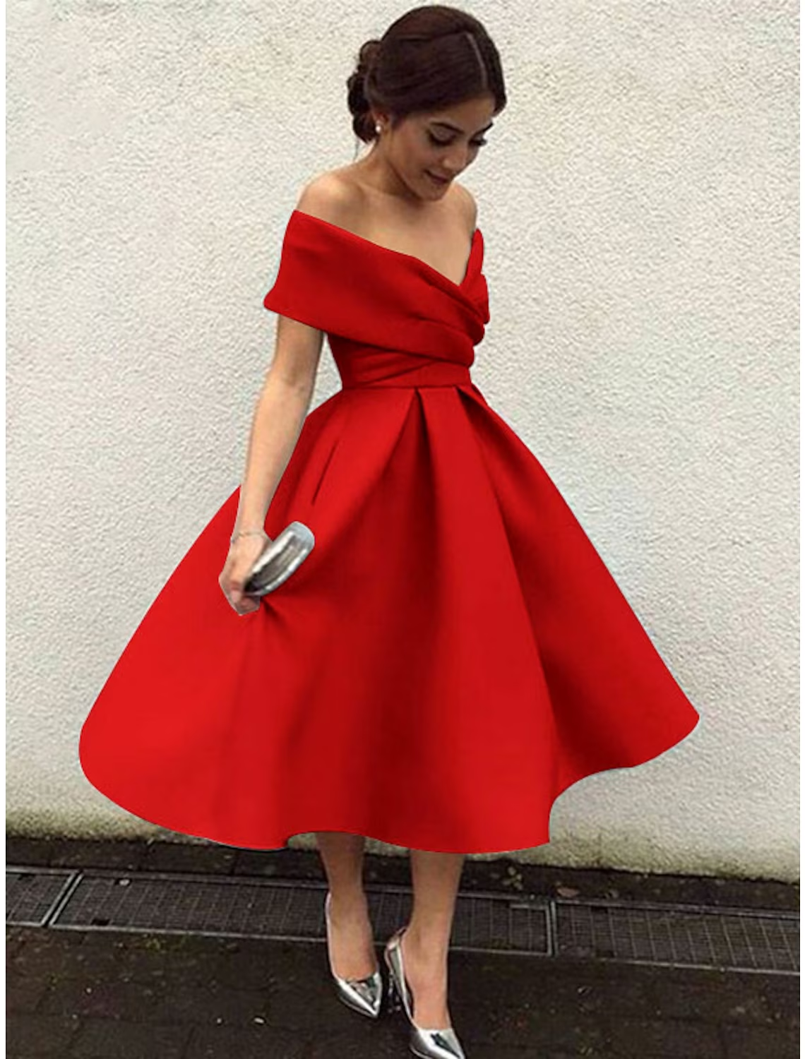 Close-up of the V-neckline and short sleeves of the A-line dress.