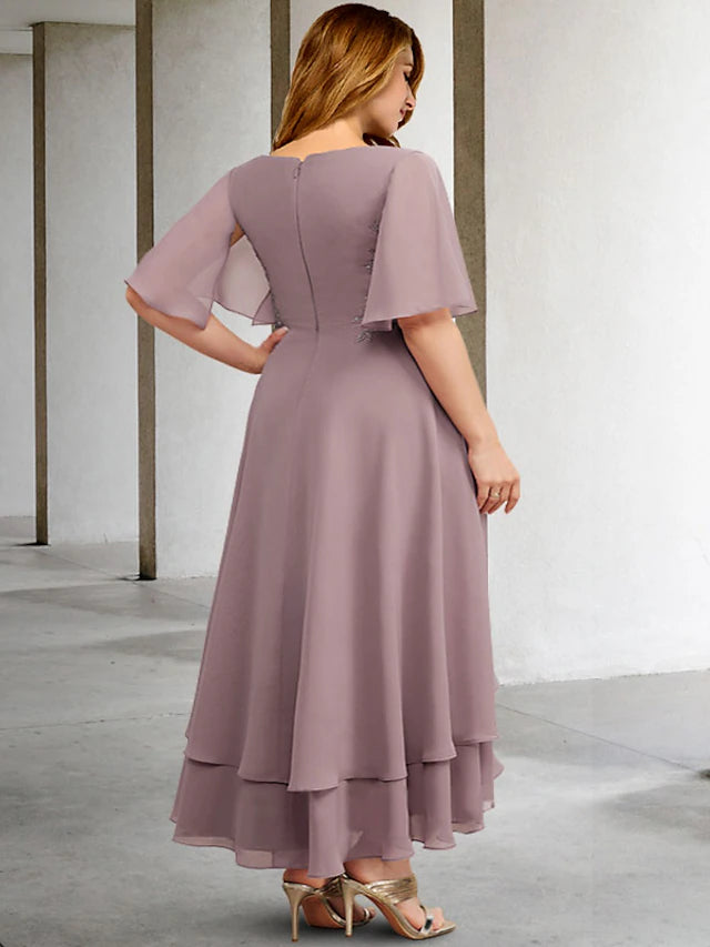 Back view of the formal chiffon gown, showcasing ruffles and appliques.