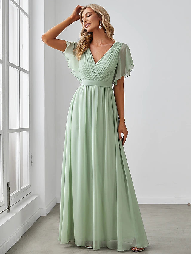 Side view of a V-neck short sleeve bridesmaid gown with ruffles.