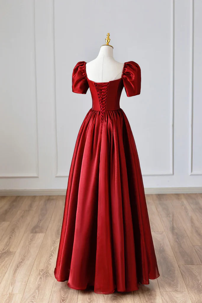 Front view of a flowing A-line satin prom dress with short sleeves and V-neck.