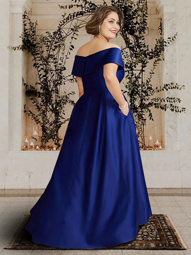 Plus size satin gown for mother of the bride featuring a sweep train.