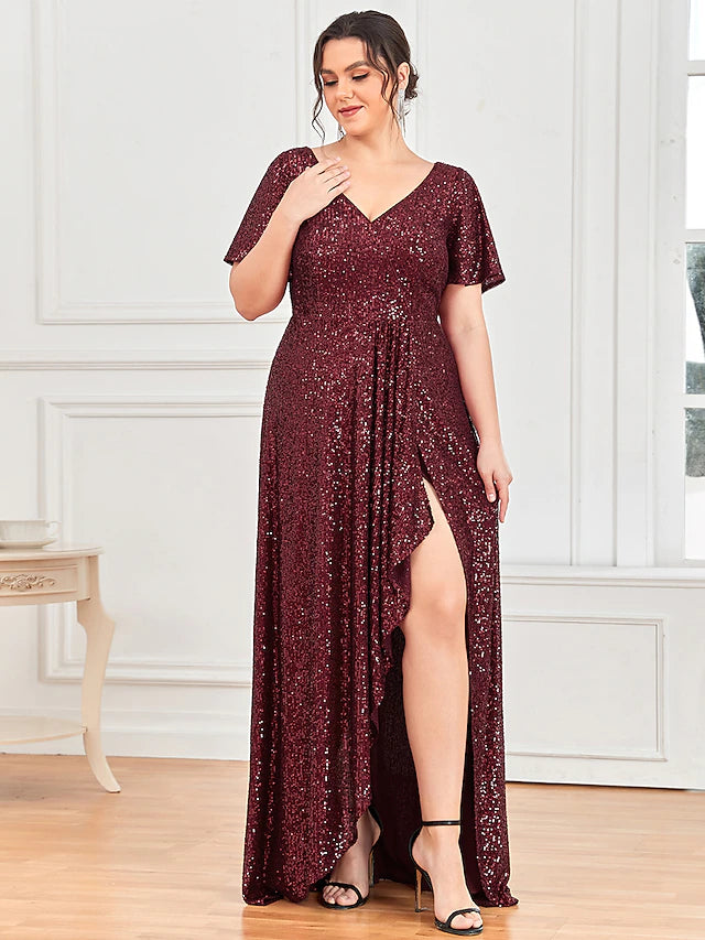 Model wearing a shimmering A-line sequined evening gown with a V-neck and short sleeves.