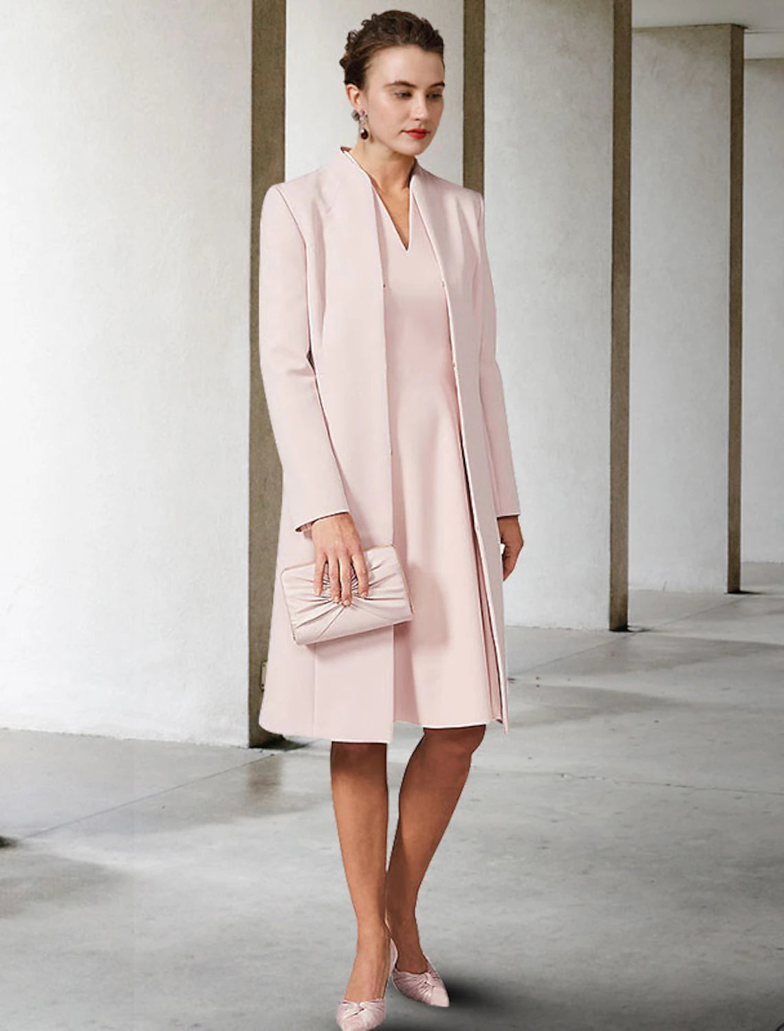 Back view of the elegant A-line dress with short sleeve jacket.