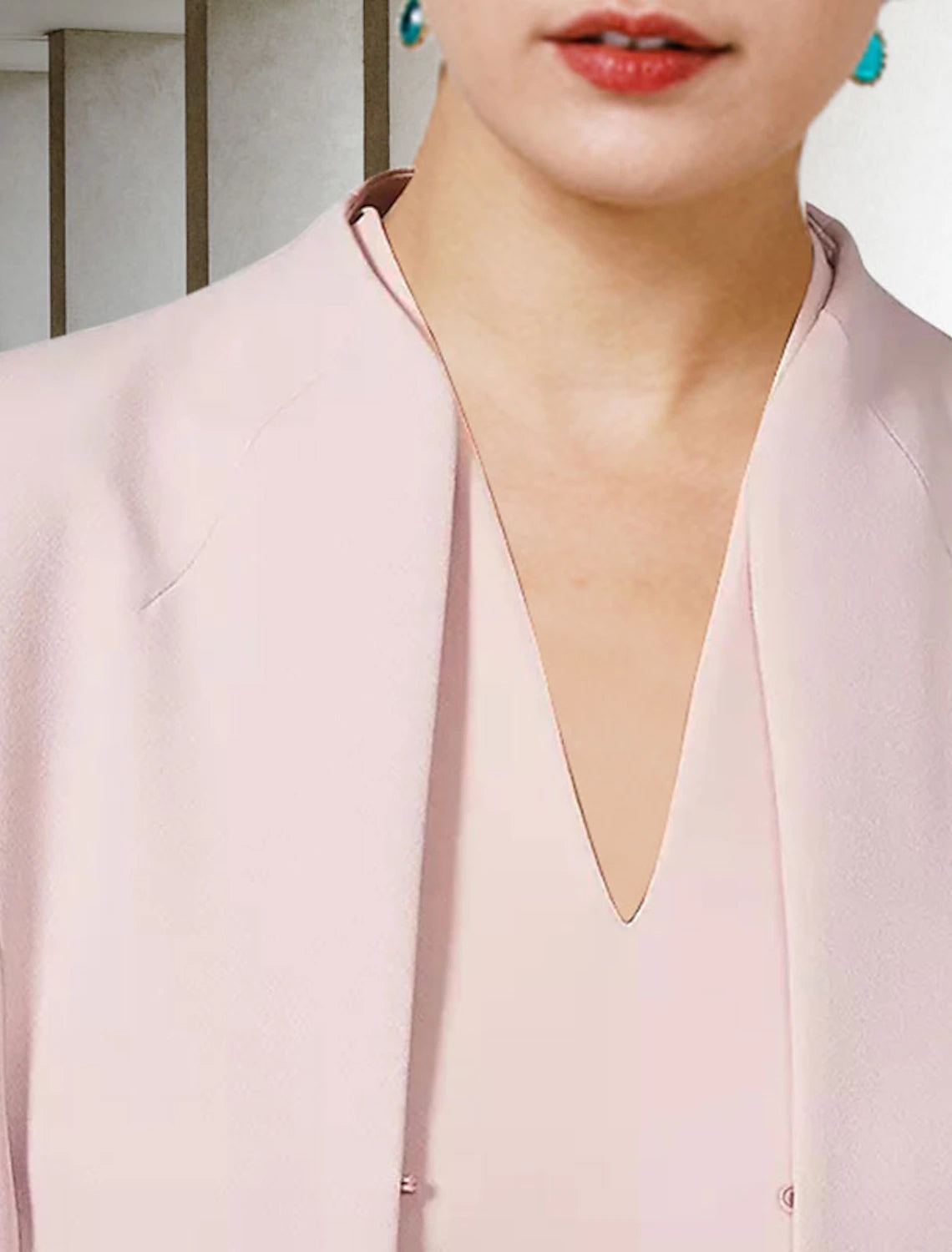 Close-up of the chiffon fabric and V-neckline on the formal dress.
