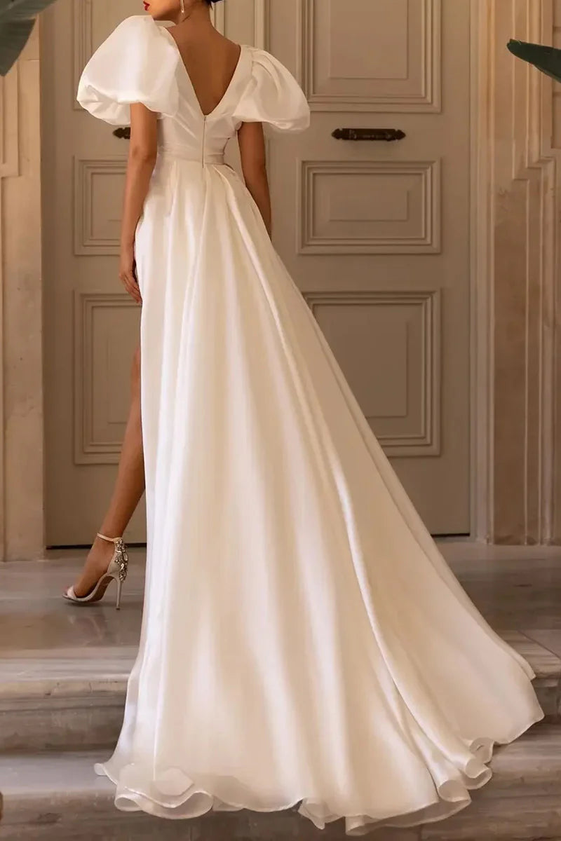 Back view of A-line V-neck wedding dress with short sleeves.