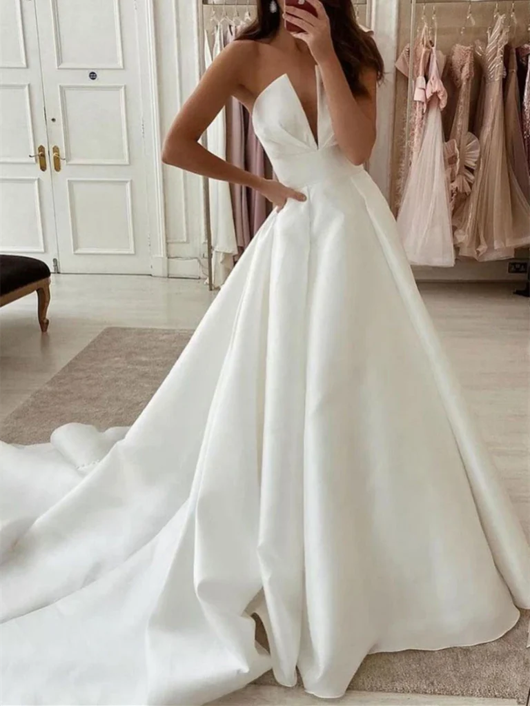 Woman wearing an elegant A-line V-neck long satin prom dress.