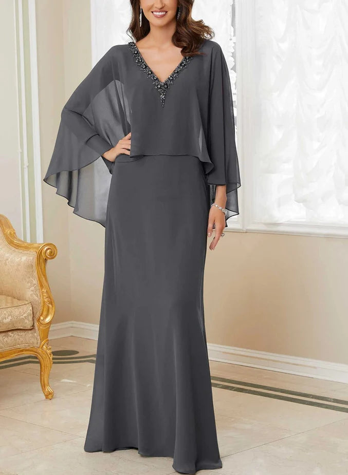 Woman wearing an elegant navy A-line V-neck Mother of the Bride dress.