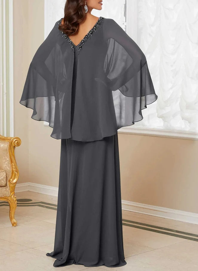 Side view of a woman in a navy A-line V-neck formal gown.