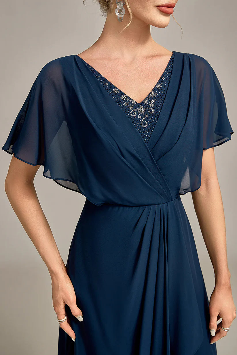 Detail of the sequin pattern on the elegant mother of the bride dress.
