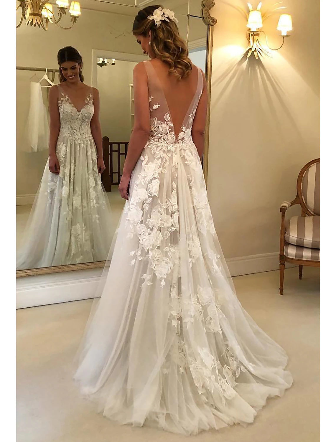 Close-up of the lace appliques on the bodice of the boho wedding dress.
