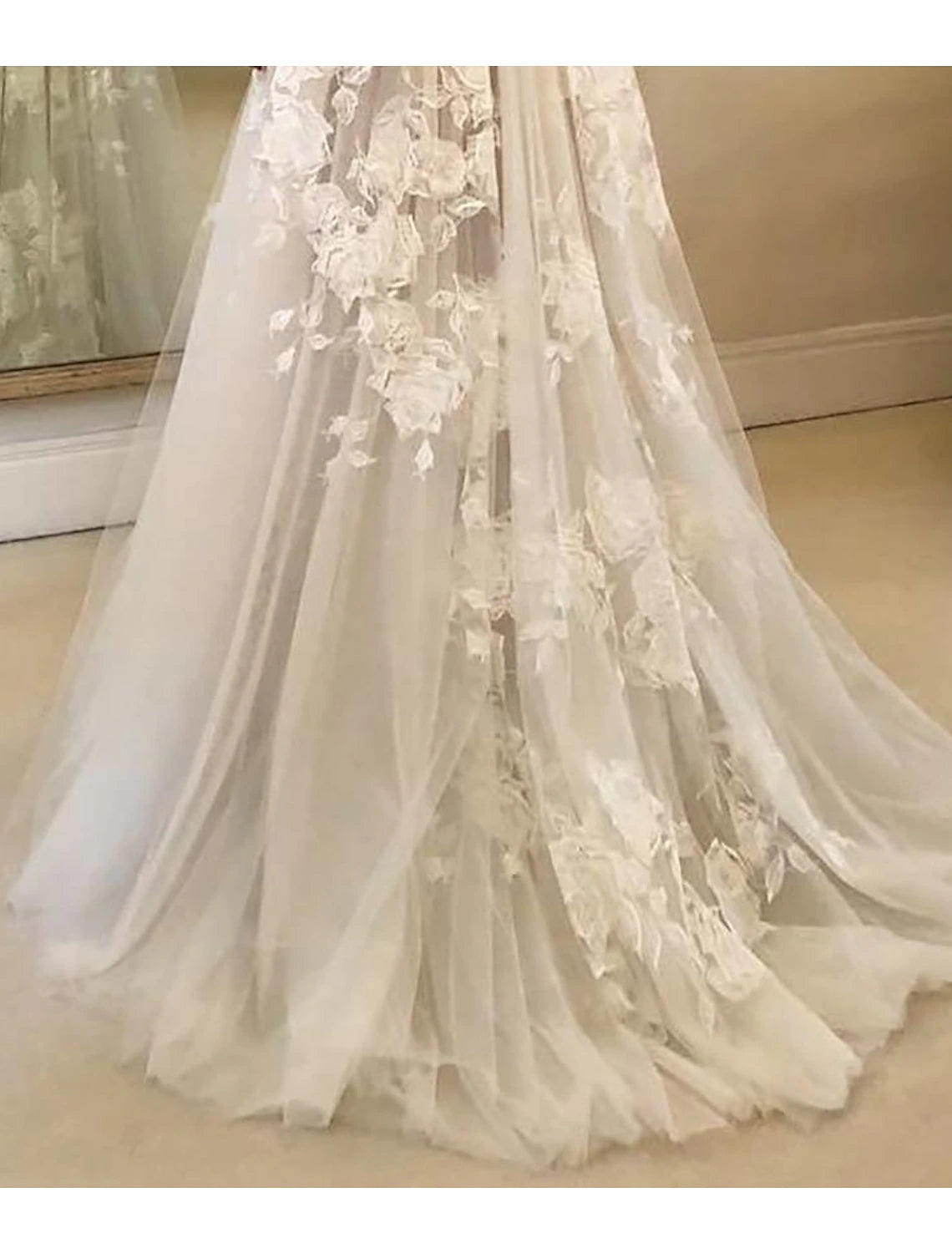 Side view of the bride wearing the boho lace wedding dress, highlighting the silhouette.