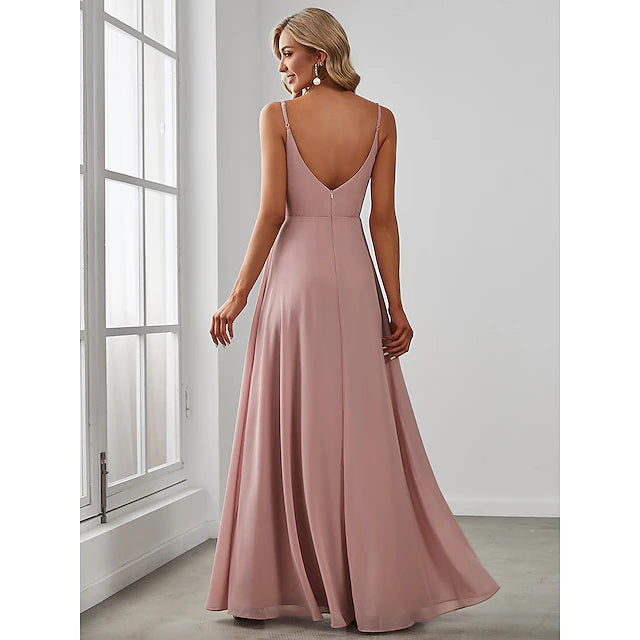 Bridesmaid dress showing V-neck and flowing chiffon skirt.