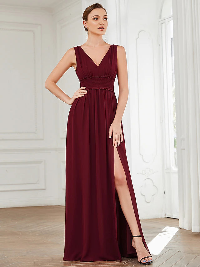 Close-up of the V-neckline and pleated details on the chiffon dress.