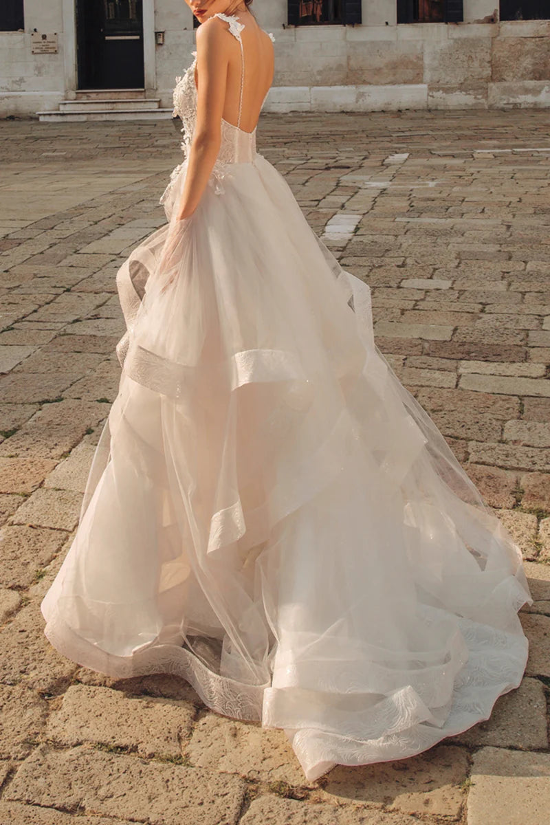Back view of A-line V-neck wedding dress with lace details.