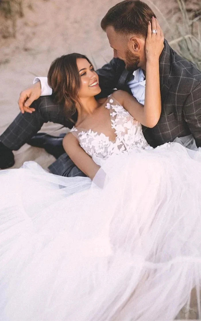 Back view of a sleeveless A-line wedding dress with delicate appliques.