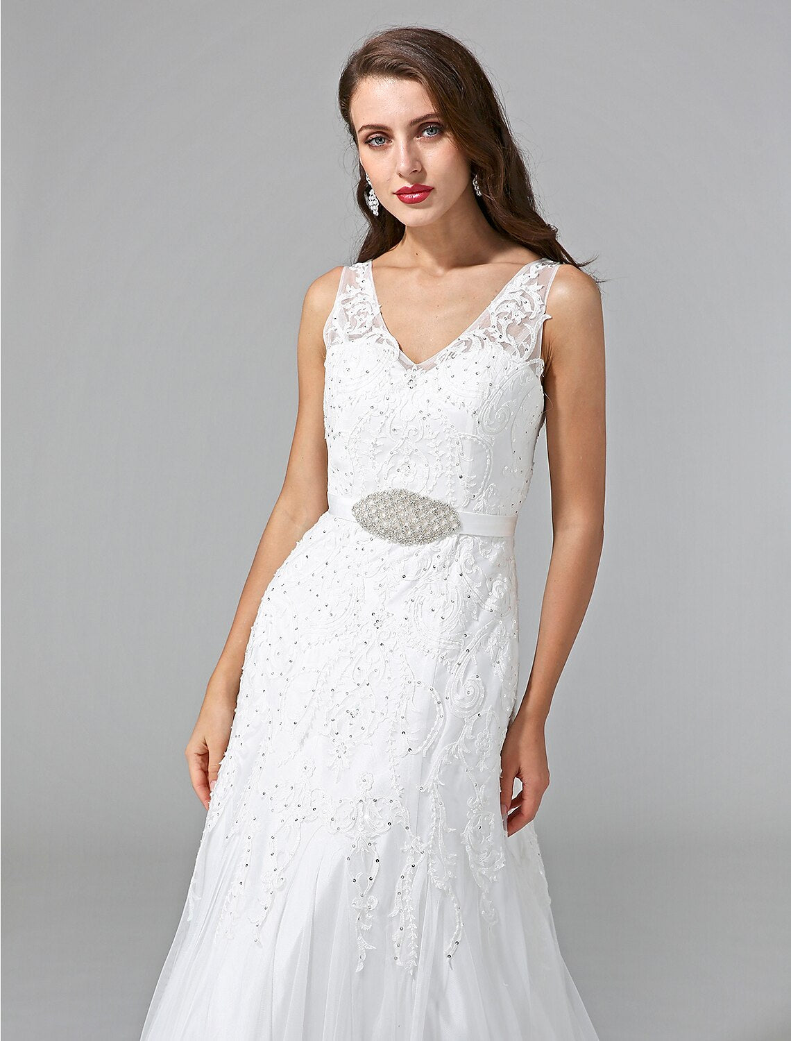 Detail of the sash and beading on the waist of the bridal gown.