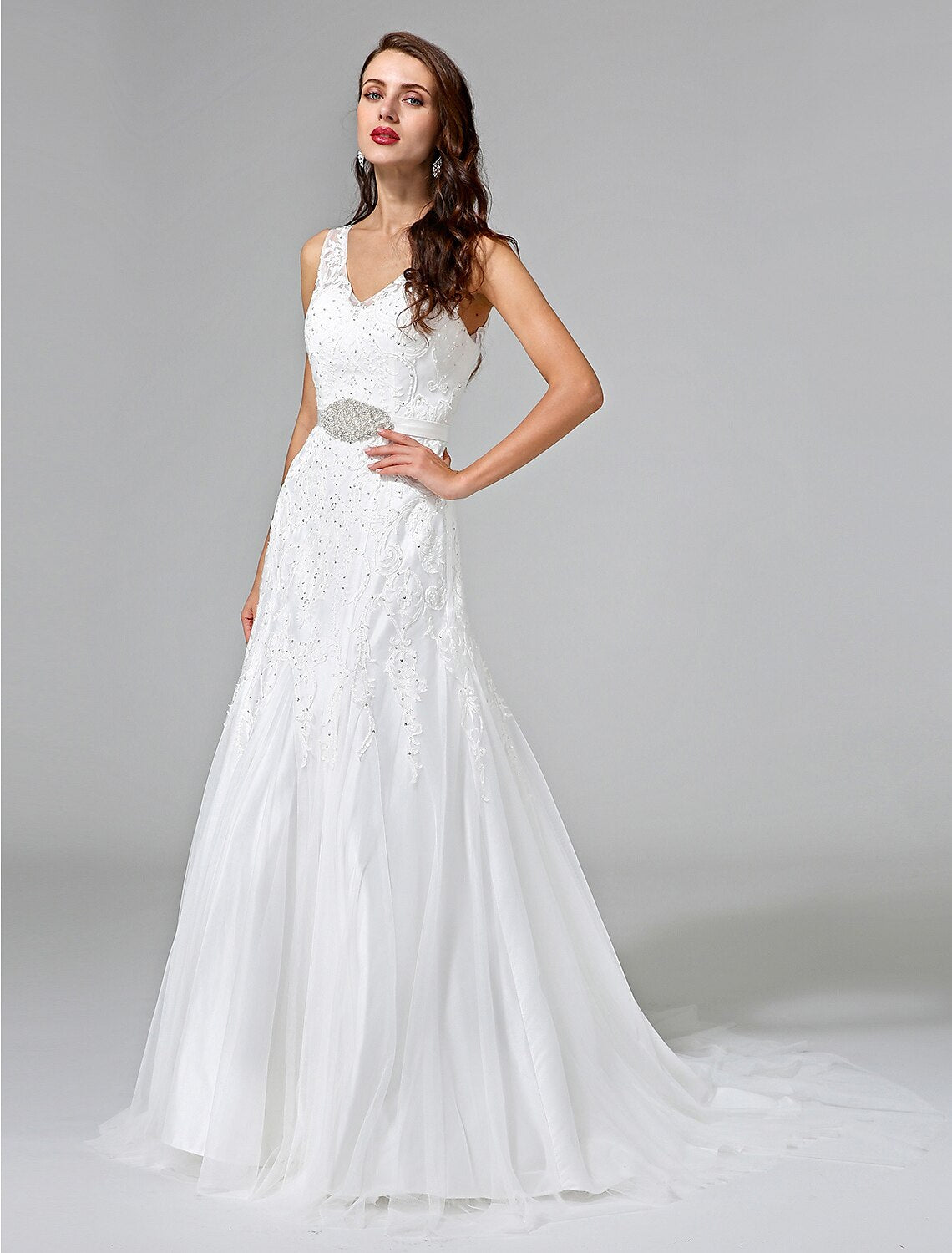 Bridal gown with a V-neck and delicate lace texture.