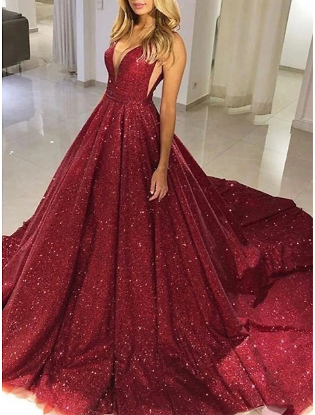 Sophisticated A-line V-neck sleeveless formal gown.