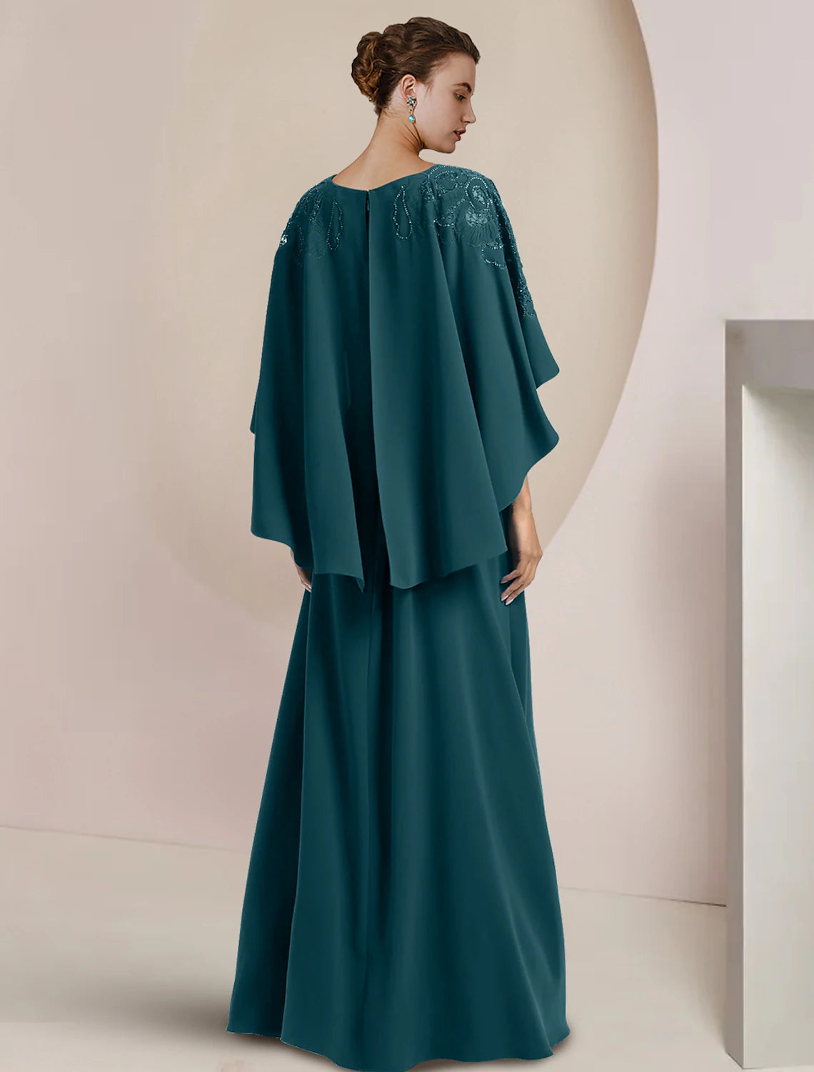 Front view of the elegant floor-length formal wedding guest dress.