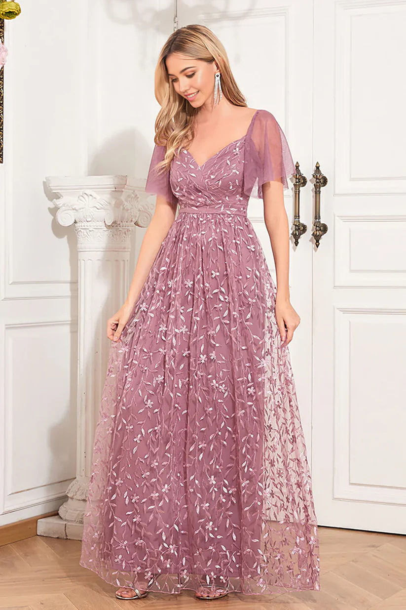 Close-up of the V-neckline and intricate appliques on the Mother of the Bride dress.