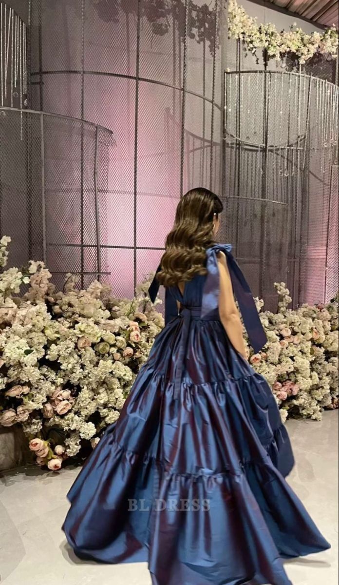 Back view of the navy blue A-line satin long dress, showcasing its flowing silhouette.