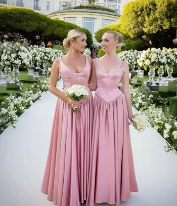 Side view of a pink satin floor-length evening gown.